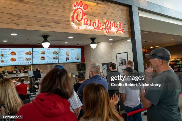 Customers stand in line to order food at a Chick-fil-A restaurant June 15, 2023 along I-87 interstate in Platekill, New York.