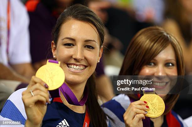 Dani King and Joanna Rowsell of Great Britain pose with their medals as they visit to support team-mate Laura Trott of Great Britain compete in the...