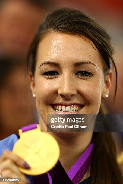 Dani King of Great Britain poses with her medal as she visits to support team-mate Laura Trott of Great Britain as she competes in the Women's Omnium...