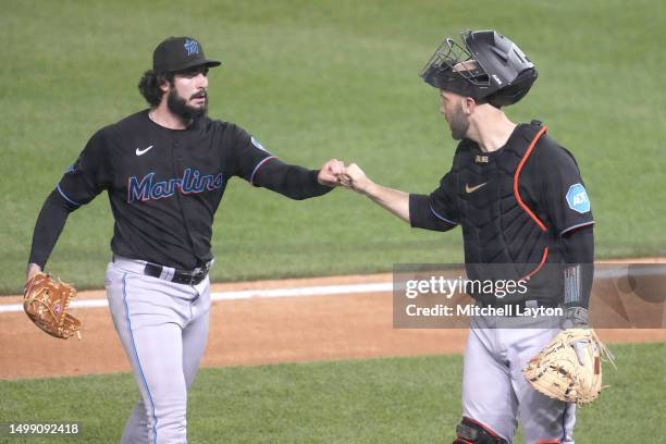Andrew Nardi of the Miami Marlins and Jacob Stallings celebrate an out in the seventh inning during a baseball game against the Washington Nationals...