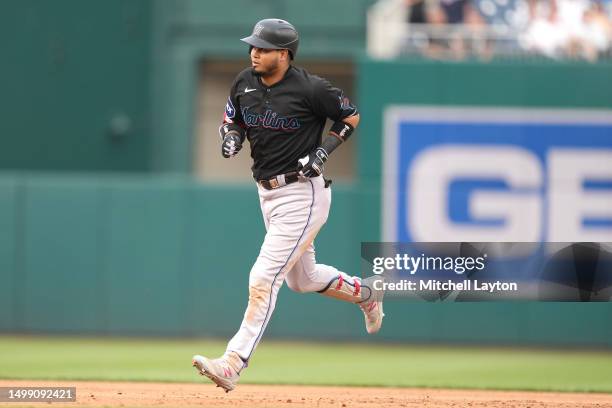 Luis Arraez of the Miami Marlins rounds the bases after hitting a two run home run in the second inning during a baseball game against the Washington...