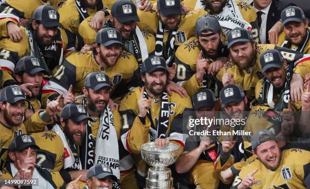 Team captain Mark Stone of the Vegas Golden Knights and teammates pose with the Stanley Cup after their 9-3 victory over the Florida Panthers in Game...