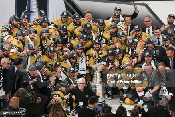 Team captain Mark Stone of the Vegas Golden Knights and teammates pose with the Stanley Cup after their 9-3 victory over the Florida Panthers in Game...