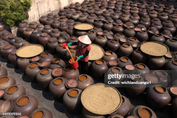 making traditional sauce in vietnam - soy sauce stock pictures, royalty-free photos & images