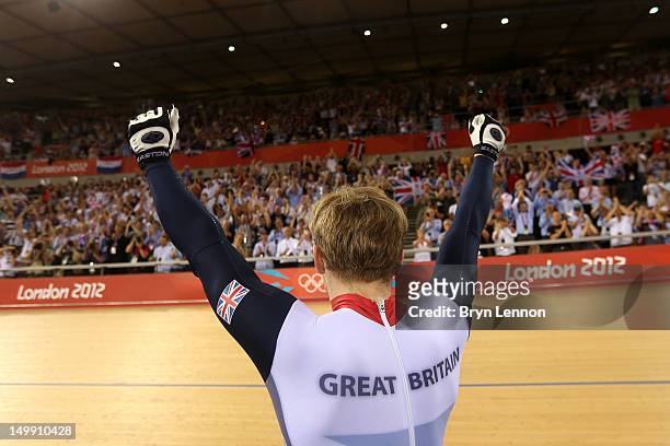 Jason Kenny of Great Britain celebrates winning the Men's Sprint Track Cycling Final and the gold medal on Day 10 of the London 2012 Olympic Games at...