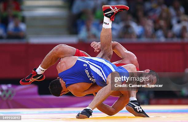 Alim Selimau of Belarus competes against Danyal Gajiyev of Kazakhstan during the Men's Greco-Roman 84 kg Wrestling Repechage on Day 10 of the London...