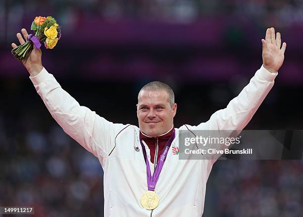 Gold medalist Krisztian Pars of Hungary poses on the podium during the medal ceremony for the Men's Hammer Throw final on Day 10 of the London 2012...