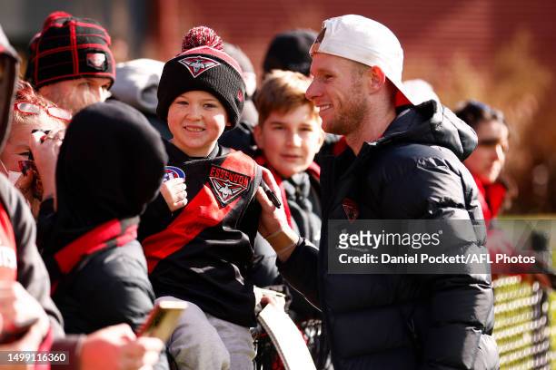 Nick Hind of the Bombers greets fans during an Essendon Bombers AFLW & AFL training session at The Hangar on June 17, 2023 in Melbourne, Australia.