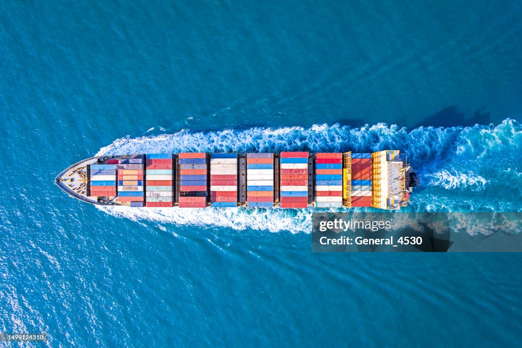 Aerial view of container ship in sea.