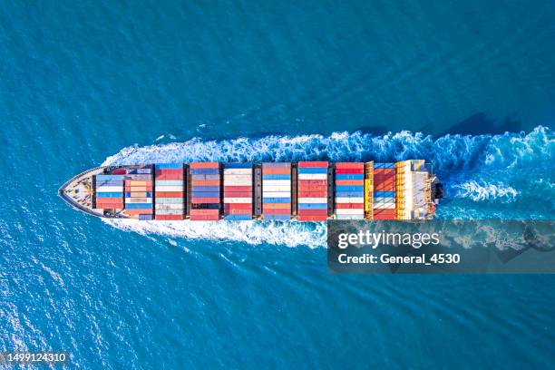 aerial view of container ship in sea. - container ships stock pictures, royalty-free photos & images