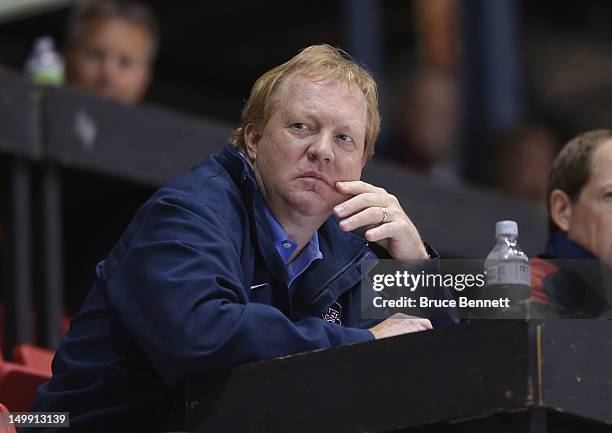 General Manager of the 2012 USA Hockey National Junior Team Jim Johannson watches the USA Blue Squad take on Team Finland at the USA hockey junior...
