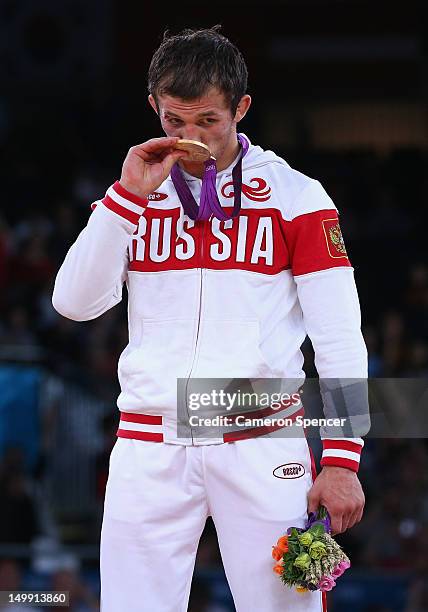 Alan Khugaev of Russia kisses his Gold medal on the podium after beating Karam Mohamed Gaber Ebrahim of Egypt in their Men's Greco-Roman 84 kg...