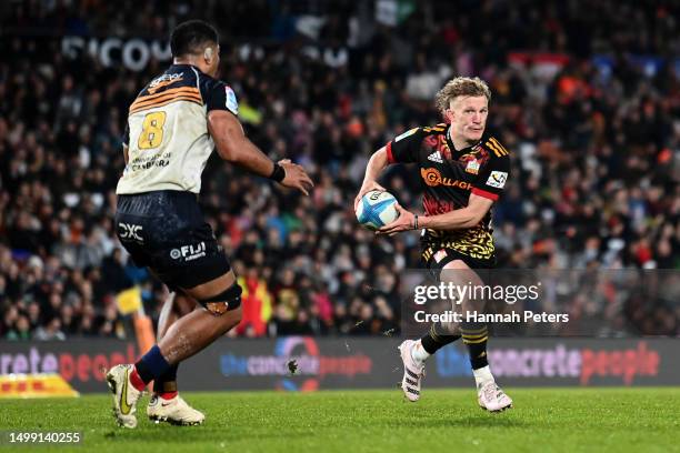Damian McKenzie of the Chiefs makes a break during the Super Rugby Pacific Semi Final match between Chiefs and Brumbies at FMG Stadium Waikato, on...