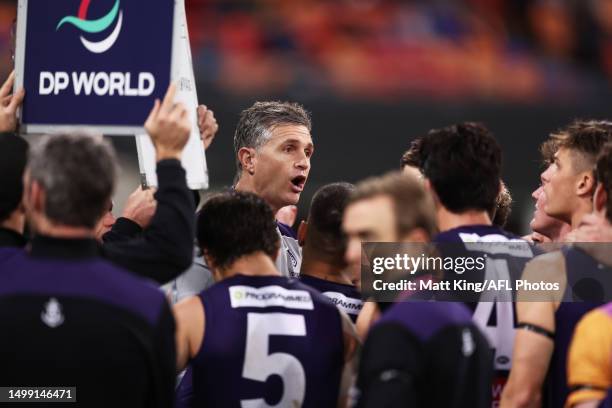 Dockers head coach Justin Longmuir speaks to players at three quarter time during the round 14 AFL match between Greater Western Sydney Giants and...