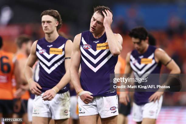 Brennan Cox of the Dockers and team mates look dejected after the round 14 AFL match between Greater Western Sydney Giants and Fremantle Dockers at...