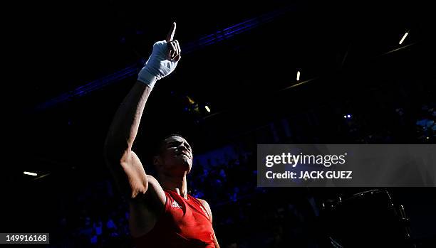 Anthony Ogogo of Great Britain exits the ring following his points decision victory over Stefan Hartel of Germany in the Middleweight boxing...