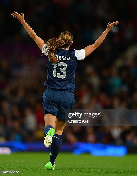 Forward Alex Morgan celebrates at the final whistle after the London 2012 Olympic Games womens semi final football match between the US and Canada at...