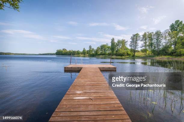 wooden pier on the lake - jetty lake stock pictures, royalty-free photos & images