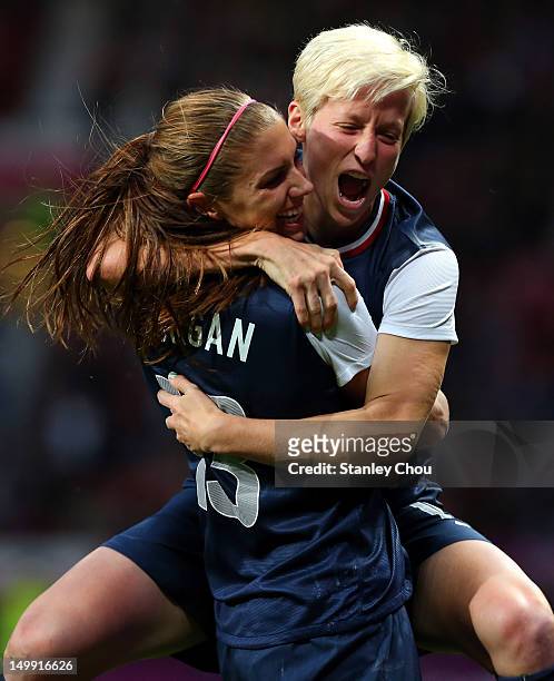 Megan Rapinoe celebrates with Alex Morgan of the United States after scoring during the Women's Football Semi Final match between Canada and USA, on...