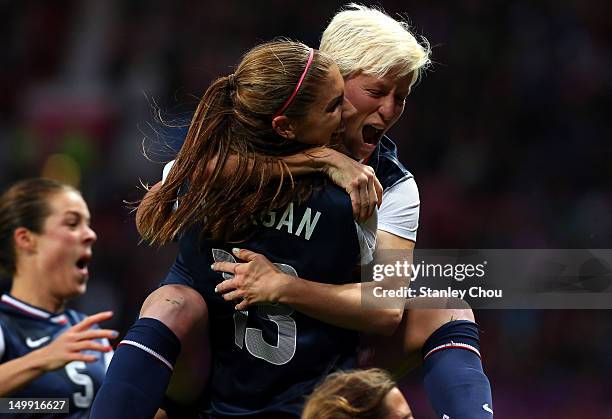 Megan Rapinoe celebrates with Alex Morgan of the United States after scoring during the Women's Football Semi Final match between Canada and USA, on...