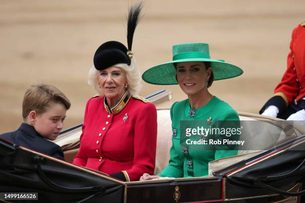 Prince George of Wales, Catherine, Princess of Wales and Queen Camilla ride in a horse drawn carriage during Trooping the Colour at Horse Guards...