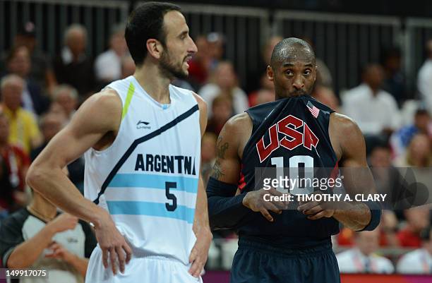 Guard Kobe Bryant stands by Argentinian guard Emanuel Ginobili during the men's basketball preliminary round match Argentina vs USA as part of the...