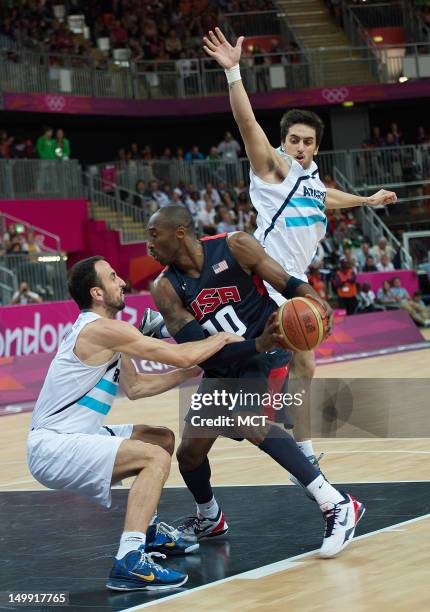 S Kobe Bryant is defended by Argentina's Manu Ginobili , left and Facundo Campazzo during their game at the Olympic Park Basketball Arena during the...