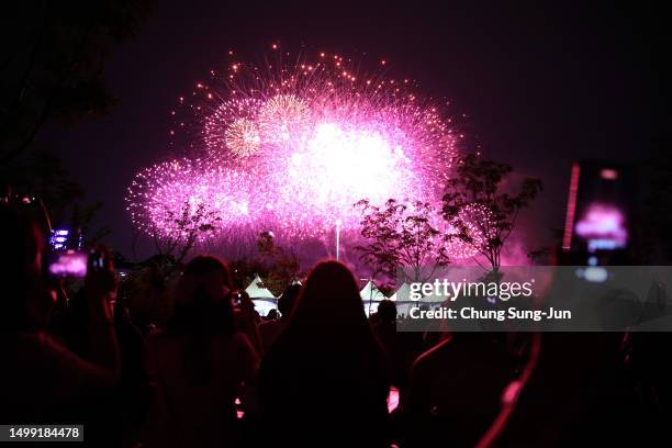 Firework explode over the Han River during the 'BTS Festa' on June 17, 2023 in Seoul, South Korea. 'BTS Festa' is marking 10 years since the...
