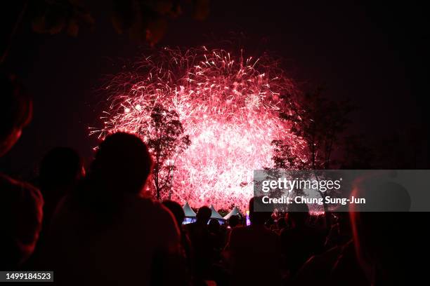 Firework explode over the Han River during the 'BTS Festa' on June 17, 2023 in Seoul, South Korea. 'BTS Festa' is marking 10 years since the...