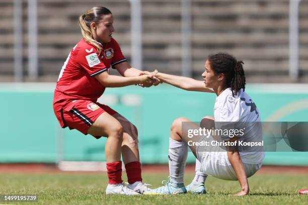 Estrella Merino Gonzalez of Leverkusen comforts Marie Omoze Okoroh of Aurich after the B-Junior Girls Final German Championship Final between Bayer...