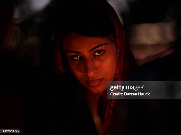 Member of the Sikh community attends a candle light vigil at the Sikh Religious Society of Wisconsin for the victims of the shooting at the Sikh...