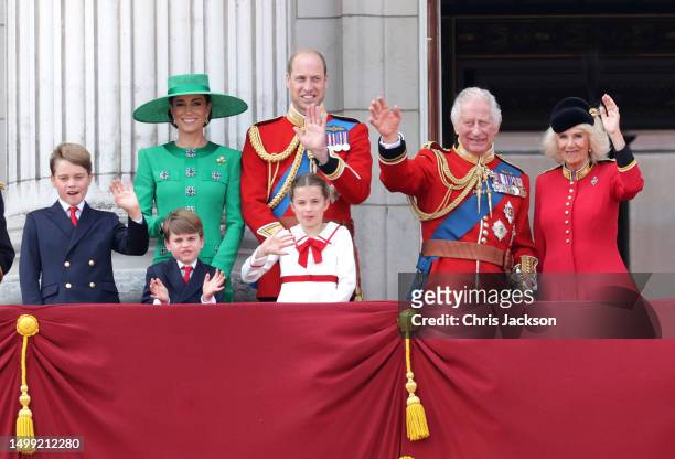 King Charles III and Queen Camilla wave alongside Prince William, Prince of Wales, Prince Louis of Wales, Catherine, Princess of Wales and Prince...