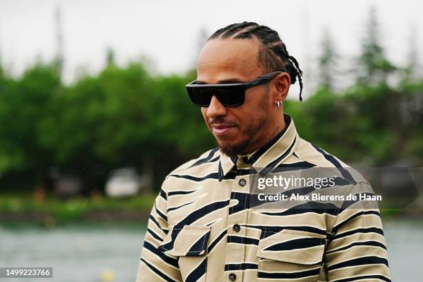 Lewis Hamilton of Great Britain and Mercedes walks in the Paddock prior to final practice ahead of the F1 Grand Prix of Canada at Circuit Gilles...