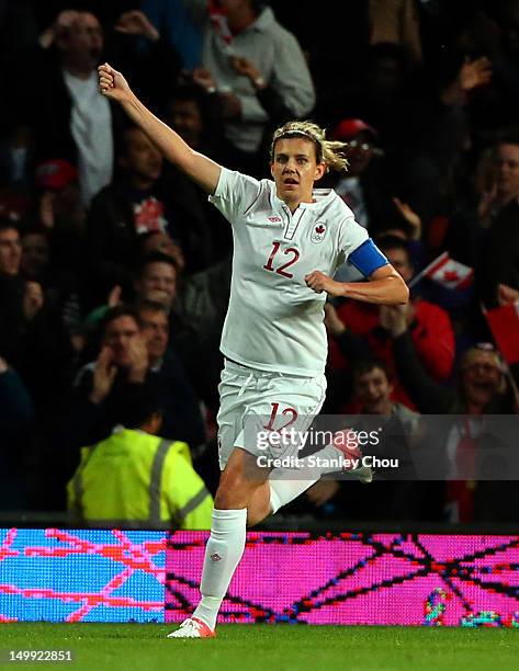 Christine Sinclair of Canada reels away after scoring the second goal against USA during the Women's Football Semi Final match between Canada and...