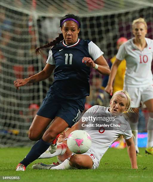 Sydney Leroux of Unitede States evades a challenge by Kaylyn Kyle of Canada during the Women's Football Semi Final match between Canada and USA, on...