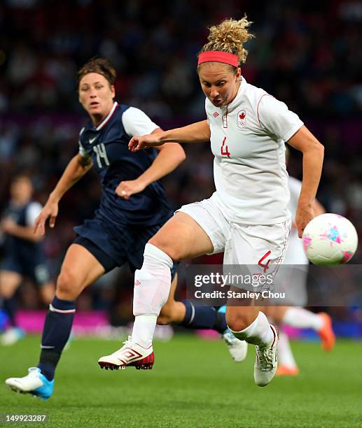 Carmelina Moscato of Canada is pursuit by Abby Wambach of Unitede States during the Women's Football Semi Final match between Canada and USA, on Day...