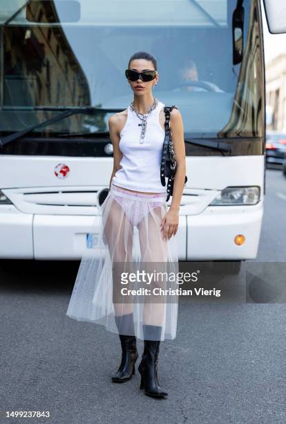 Guest wears white shirt, transparent skirt outside MSGM during the Milan Fashion Week - Menswear Spring/Summer 2024 on June 17, 2023 in Milan, Italy.