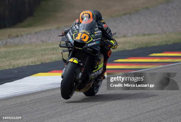 Luca Marini of Italy and Mooney VR46 Racing Team lifts the front wheel during the MotoGP of Germany - Qualifying at Sachsenring Circuit on June 17,...