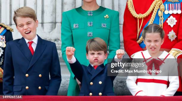 Prince George of Wales, Prince Louis of Wales and Princess Charlotte of Wales watch an RAF flypast from the balcony of Buckingham Palace during...