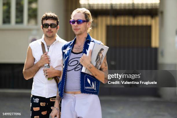 Guests are seen wearing on the left black sunglasses, silver and gold hoop earrings, silver necklaces, silver rings, a silver bracelet, a white...