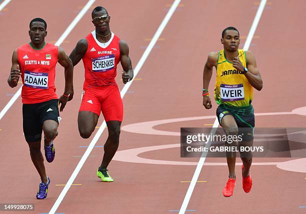 Saint Kitts & Nevis' Antoine Adams, Switzerland's Reto Schenkel and Jamaica's Warren Weir compete in the men's 200m heats at the athletics event...