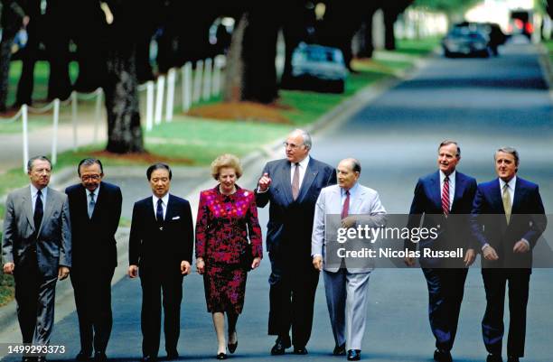 The leaders of the Group of Seven industrialized nations meet at the 16th G7 Economic summit walk on the campus of Rice University in July 1990 in...