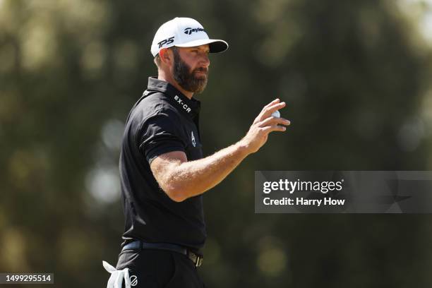 Dustin Johnson of the United States reacts to a birdie putt on the first green during the third round of the 123rd U.S. Open Championship at The Los...