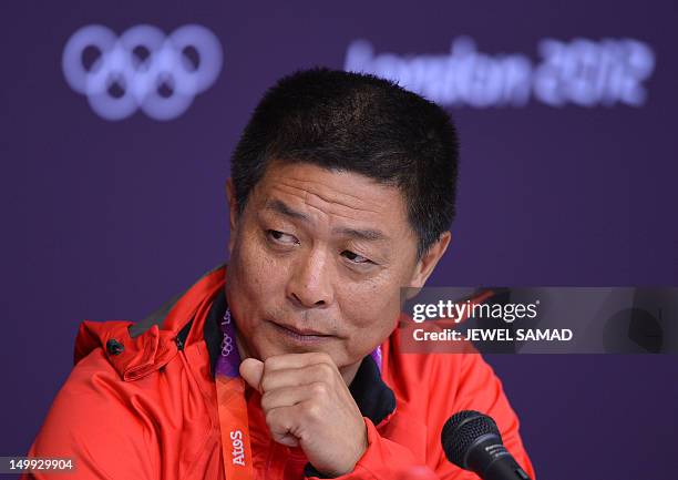 Feng Shuyong, leader of China's Track and Field Athletics team, addresses a press conference at the Athletics stadium in the 2012 London Olympic...