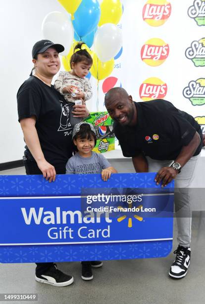 Eddie Jackson makes a surprise appearance at Walmart to celebrate amazing summer savings on Frito-Lay snacks and PepsiCo beverages on June 17, 2023...