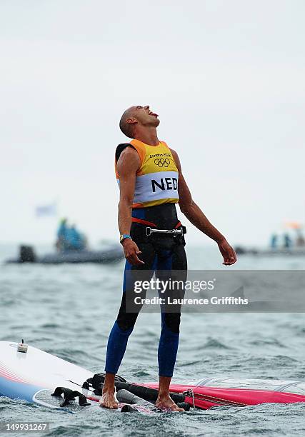 Dorian Van Rijsselberge of Netherlands celebrates after winning gold in the Men's RS:X Sailing on Day 11 of the London 2012 Olympic Games at the...