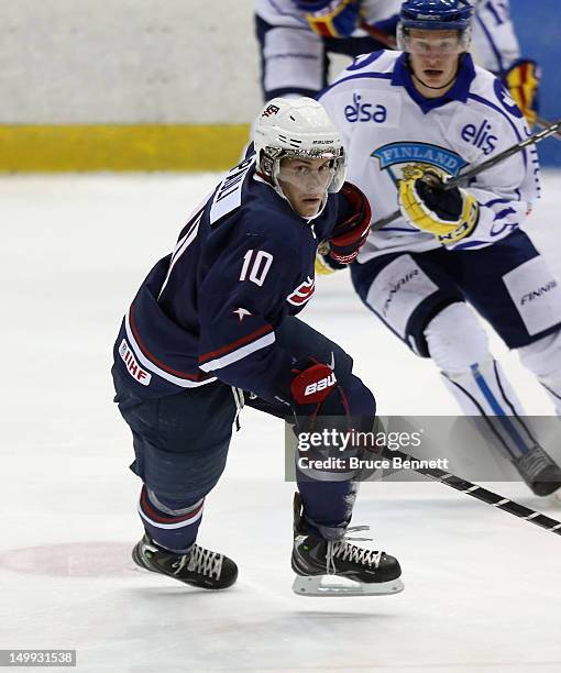 Thomas DiPauli of the USA Blue Squad skates against Team Finland at the USA hockey junior evaluation camp at the Lake Placid Olympic Center on August...