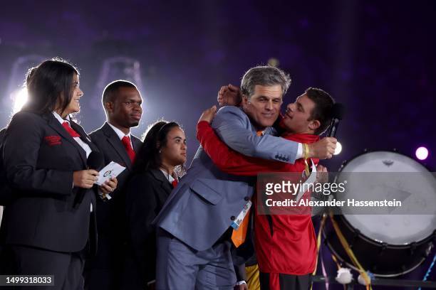 Special Olympics chairman Timothy Shriver reacts with a Syrian Athlete during his speak at the opening ceremony of the Special Olympics World Games...
