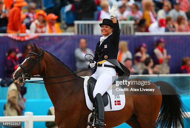 Anne Van Olst of Denmark riding Clearwater celebrates after competing in the Team Dressage Grand Prix Special on Day 11 of the London 2012 Olympic...