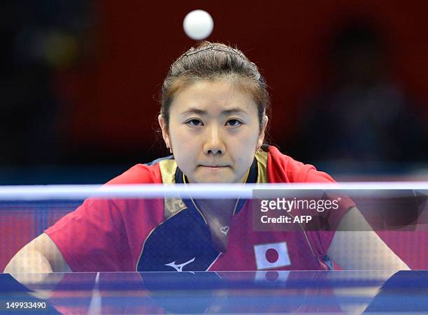 Japan's Ai Fukuhara watches the ball during the 2012 London Olympic Games table tennis women's team gold medal matches at the ExCeL arena in London...
